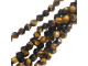 For mesmerizing style, try these Dakota Stones beads. These tiger eye beads feature a round shape with a star cut filled with triangular facets. You'll love using these versatile beads in necklaces, bracelets, and earrings. The amber brown color will work well in earthy looks, luxurious styles, and more. Tiger eye is a variety of quartz which is chatoyant. Metaphysical Properties: Tiger eye can be used to balance pessimistic behavior and it is said to dissolve negative energy and thought patterns. This "all-seeing" stone allows perspective on any situation and can help gently attune the Third Eye. It is said to enhance psychic abilities, such as clairvoyance. It has also been used to enhance wealth and vitality.Because gemstones are natural materials, appearances may vary from piece to piece.