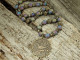 With a multitude of color, these Dakota Stones gemstone beads really stand out. These beads feature a classic round shape that will work in a variety of designs. The surface of each bead is smooth, but some feature open crevices that reveal the sparkling druzy within. Druzy is a coating of fine crystals on a rock fractured surface, vein, or within a geode. These beads feature a wonderful rainbow of purple, blue, green, and gold colors. They are the perfect size for adding to matching necklace and bracelet sets.Because gemstones are natural materials, appearances may vary from bead to bead. Each strand includes approximately 47 beads.