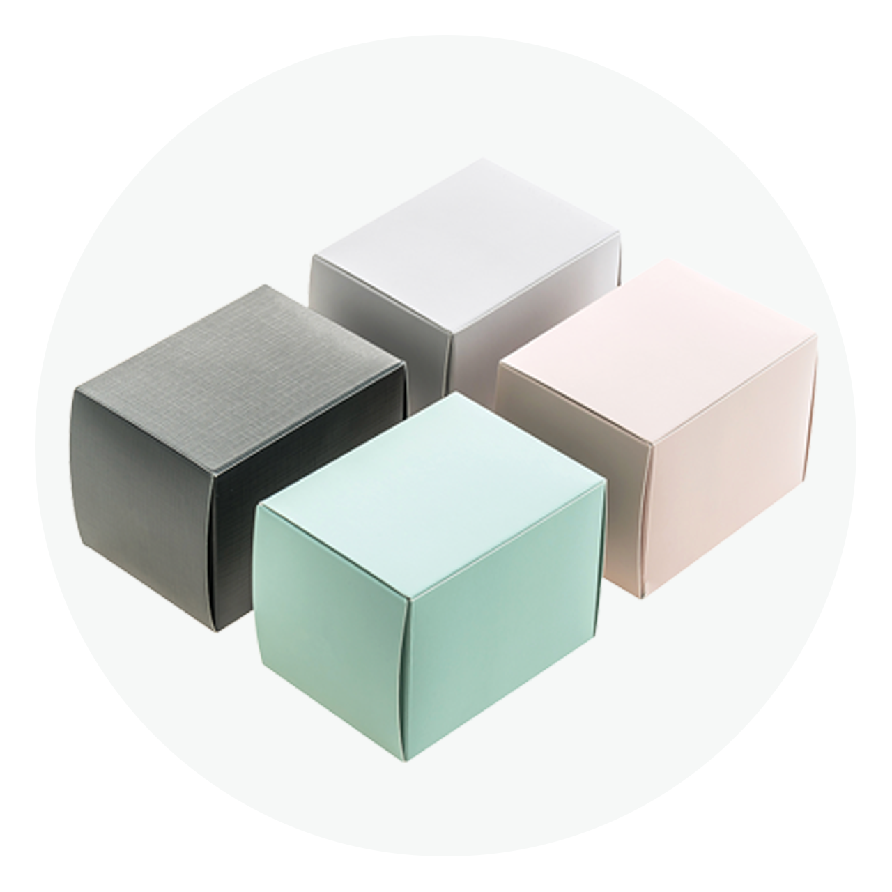 Four pastel folding cartons with tuck top closures in black, mint, blush, and white.