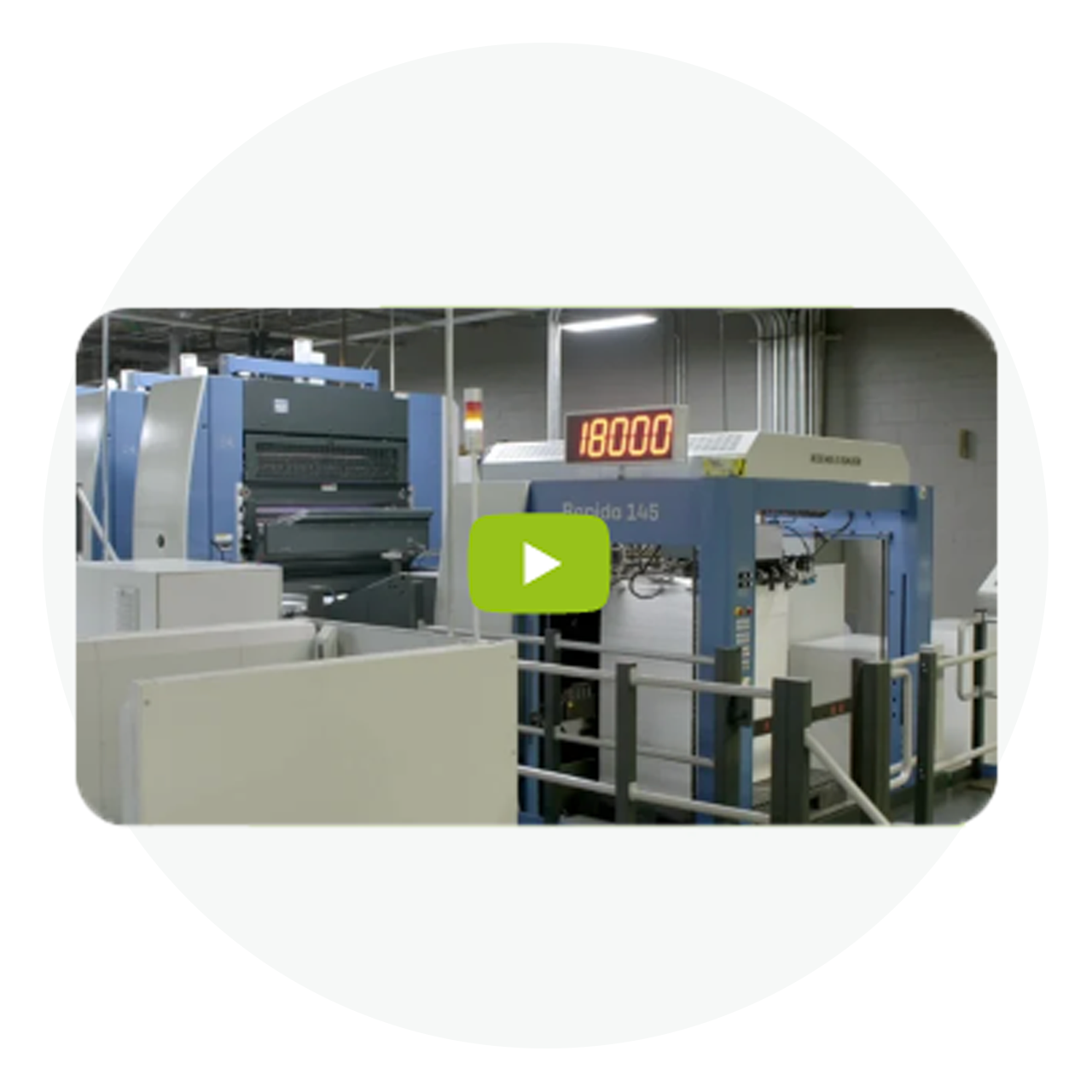 Offset printing machine with digital counter and paper feed trays in production environment.