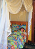 Cotton box mosquito net draped over a single bed