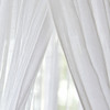 Close-up of soft white cotton mosquito netting draped open
