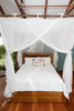 Cotton mosquito net box showing four opening drape design