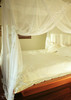 Cotton mosquito net box draped open showing interior space