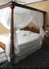 Cotton mosquito net box canopy on four poster bed