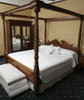 Four poster bed frame ready for silk bed canopy installation