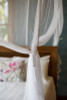 Polyester mosquito net box corner tie and hem detail