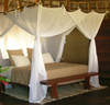 Super King cotton mosquito net box draped over super king bed