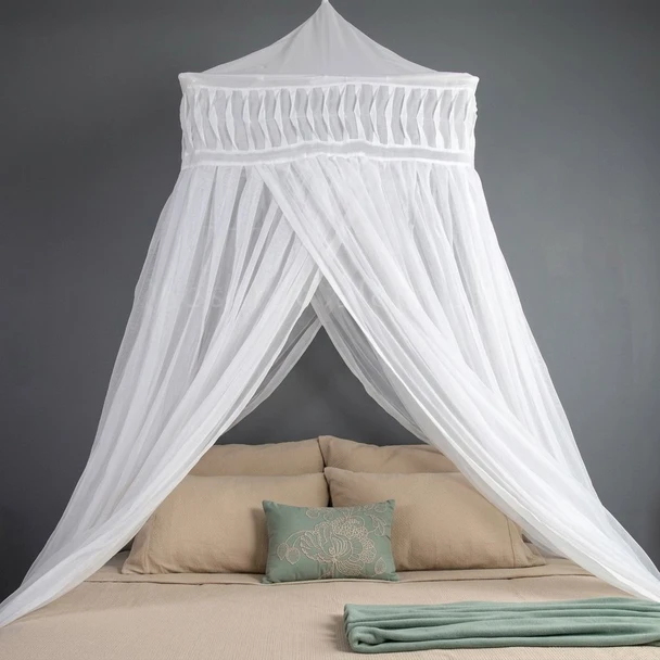 Natural cotton mosquito net with three openings over a king or queen bed