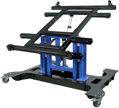 Multi-position panel assembly table with electric tilting and height adjustment lowered.