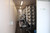 View along the container interior past the control cabinet to the membrane rack and its stainless high-pressure manifold