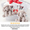 Baskits Twins, plush stuffed teddy bear toys with fluffy fur and floppy ears, accompanied by matching gift items including T-shirts with dog illustrations and a greeting card, in a gift box arrangement.