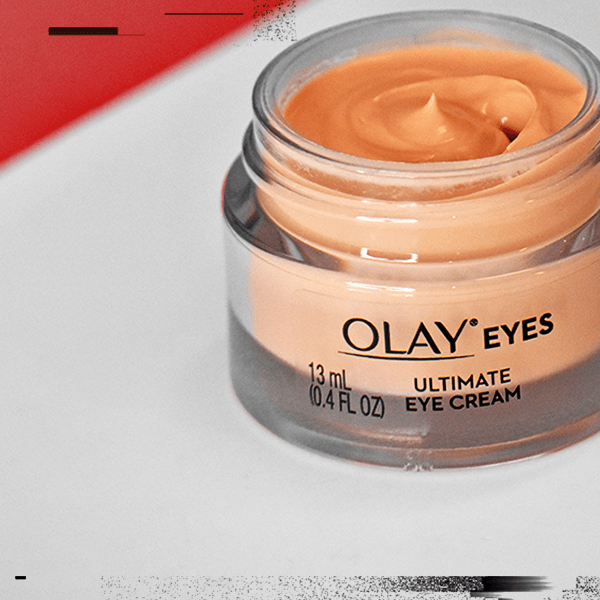 Open jar of Ultimate Eye Cream floating on light gray background with black accents. Promo reads: Extra $2 OFF one eyes product with code EYES.