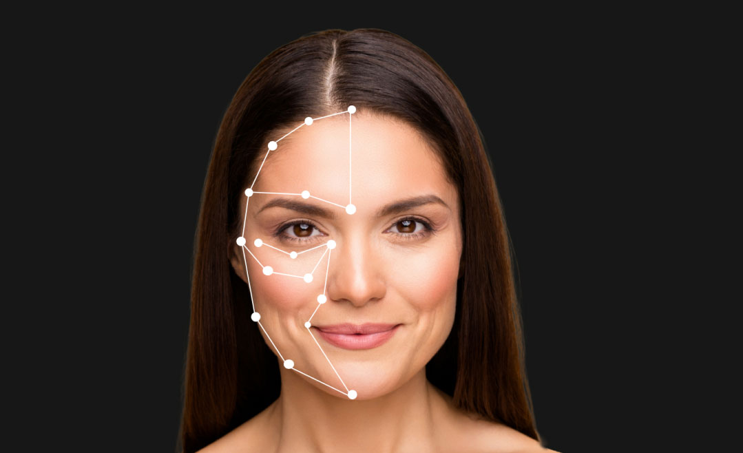 AI skin analysis technology mapping areas on a young woman’s face to assess skin condition and recommend personalized skincare solutions.