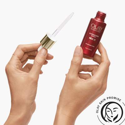 holding max hydration serum in hand