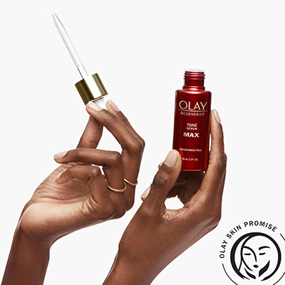 holding max tone serum in hand