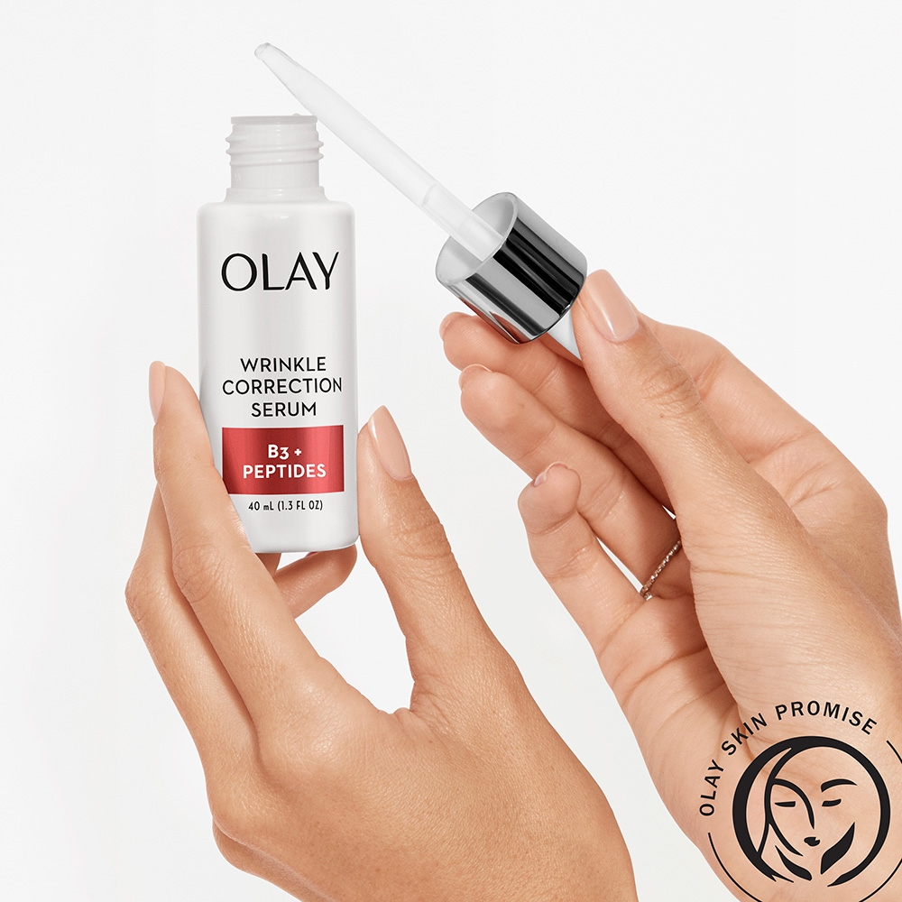 holding deep hydration serum in hand