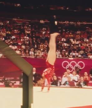 Young Aly performing on the balance beam competition. Circa 2004