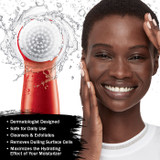 Model looking radiant soft skin after using Olay Regenerist face cleansing device.