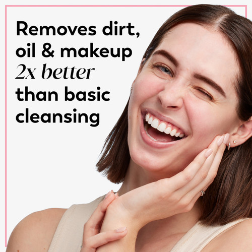 Model posing with hand on face smiling. Removes dirt, oil and makeup 2x better than basic cleansing
