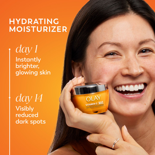 Model posing with Vitamin C MAX Lightweight Hydrating Moisturizer jar in hand. Day 1 instantly brighter, glowing skin. Day 2 visibly reduced dark spots. Model posing with Vitamin C MAX Lightweight Hydrating Moisturizer jar in hand. Day 1 instantly brighter, glowing skin. Day 2 visibly reduced dark spots.