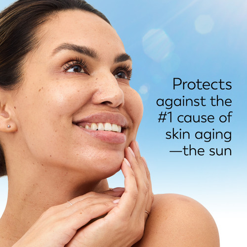 Model posing and smiling. Protects against the #1 cause of skin aging- the sun