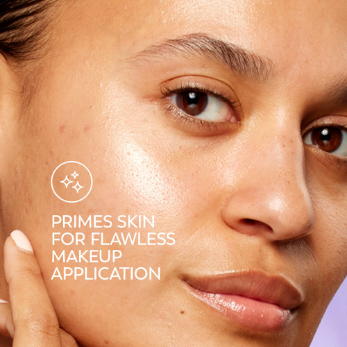 Model posing. Primes skin for flawless makeup application