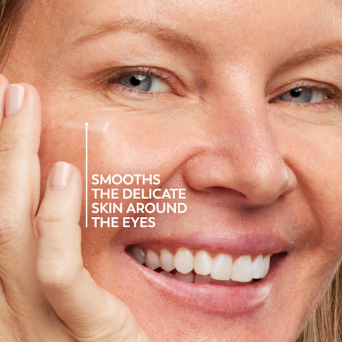 Model posing and smiling. Smooths the delicate skin around the eyes