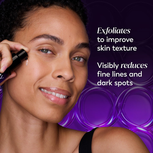 Model posing applying Regenerist Resurfacing Peel Night Treatment to face. Exfoliates to improve skin texture. Visibly reduces fine lines and dark spots.