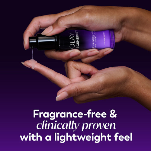Model holding Regenerist Resurfacing Peel Night Treatment bottle applying to finger. Fragrance free and clinically proven with a lightweight feel.