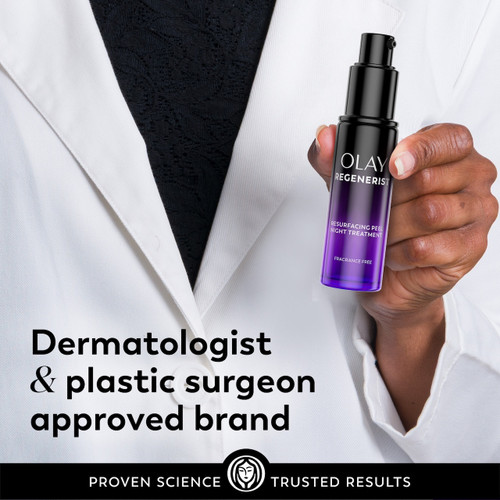 Model posing in lab coat holding Regenerist resurfacing peel Night Treatment bottle. Dermatologist and plastic surgeon approved brand.