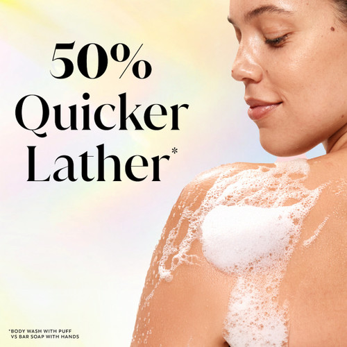 Model posing back facing while lathering Fresh Radiance Body Wash on shoulder. 50% quicker lather.*. *body wash with puff vs bar soap with hands