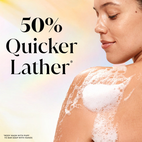 Model posing back facing while lathering Fresh Radiance Body Wash on shoulder. 50% quicker lather.*. *body wash with puff vs bar soap with hands