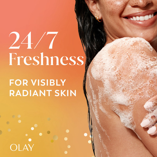 Model posing lathering body wash on arm. 24/7 Freshness for visibly radiant skin