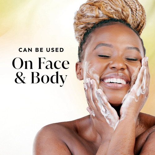 Model posing and smiling showing glowing skin and lathering soap on face. Can be used on face and body