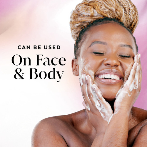 Model posing and smiling showing glowing skin and lathering soap on face. Can be used on face and body