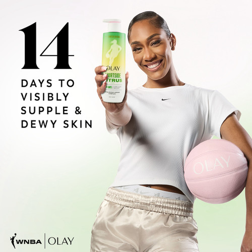 A'jA Wilson posing with basketball smiling holding Intensely Hydrating Body Wash. 14 days to visibly supple and dewy skin