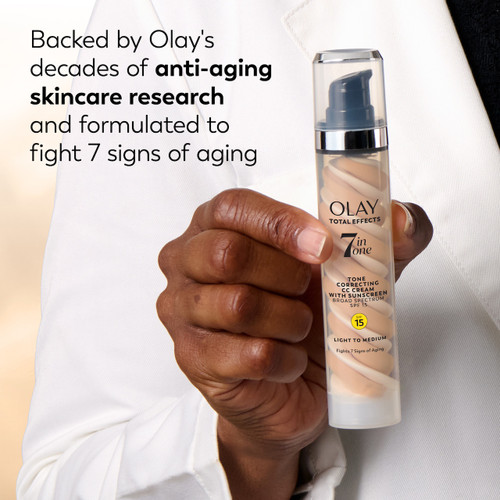 Total Effects 7 In One CC Tone Correcting Moisturizer SPF 15 bottle n hand. Backed by Olay's decades of anti aging skincare research and formulated to fight 7 signs of aging
