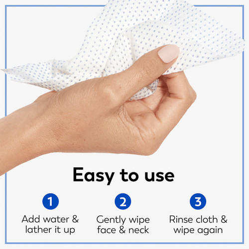 Model holding cleansing cloth in hand. Easy to use. Add water and lather it up. Gently wipe face and neck. Rinse cloth and wipe again.