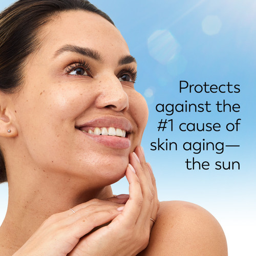 Model posing and smiling. Protects against the #1 cause of skin aging. The sun. Model posing and smiling. Protects against the #1 cause of skin aging. The sun.