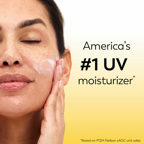 Model posing applying Olay Complete Lotion Moisturizer with SPF 15 Normal to face. America's #1 UV moisturizer* *based in P12M Neilson x AOC unit sales