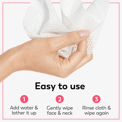 Model holding cleansing cloth in hand. Easy to use. Add water and lather it up. Gently wipe face and neck. Rinse cloth and wipe again.