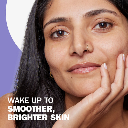 Wake up to smoother, brighter skin. Model with face in hand.