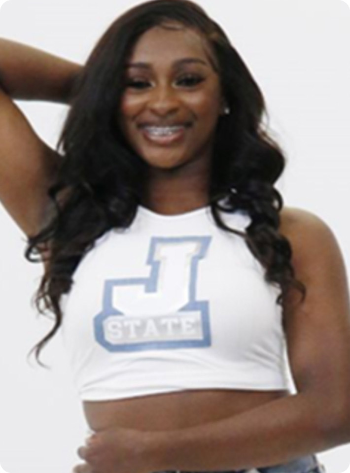 Close up image of Dejzanna Smith wearing a  cheerleader uniform