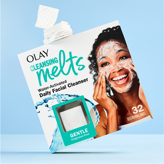 Package of Olay Gentle Cleansing Melts 32 count with dye-free squares of cleansing melts floating from the top of the package