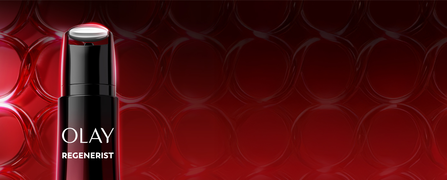 Zoomed in image of the top of the Olay Face and Neck Treatment to showcase the roller application tip on a glowing red background