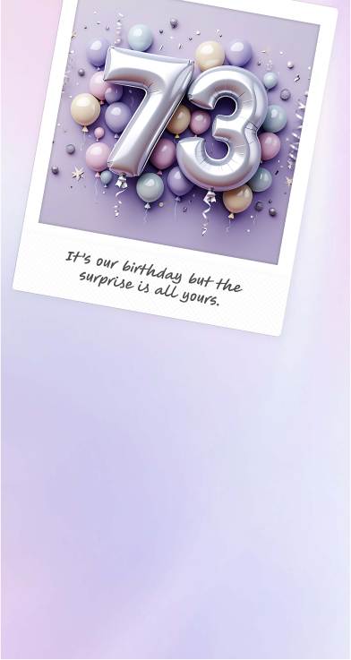 Silver balloon 73 surrounded by silver and pink balloons in a Polaroid picture frame to celebrate Olay’s 73rd birthday.