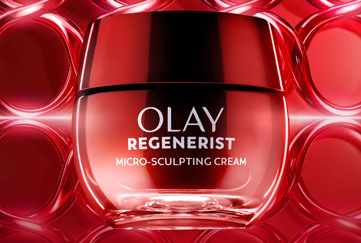 Brilliant red glass jar of Olay Regenerist Micro-Sculpting Cream alongside a People magazine Hall of Fame Winner award badge.