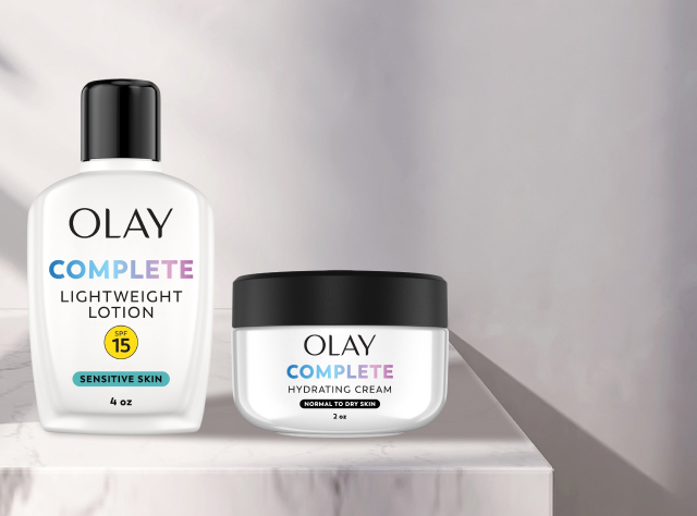 Two Olay Complete collection products on a white marble countertop and discount code HYDRATE3