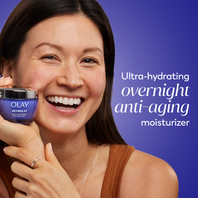 Model posing with Olay Retinol 24 Night Moisturizer jar in hand. Ultra hydrating overnight anti aging moisturizer